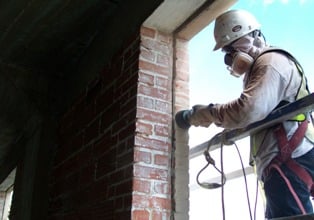 Chamberlin Guy Working Brick Wall